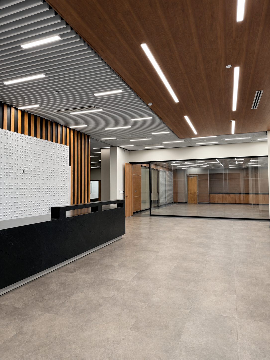 Lobby — Braille Feature Wall & Linear Wood Ceiling